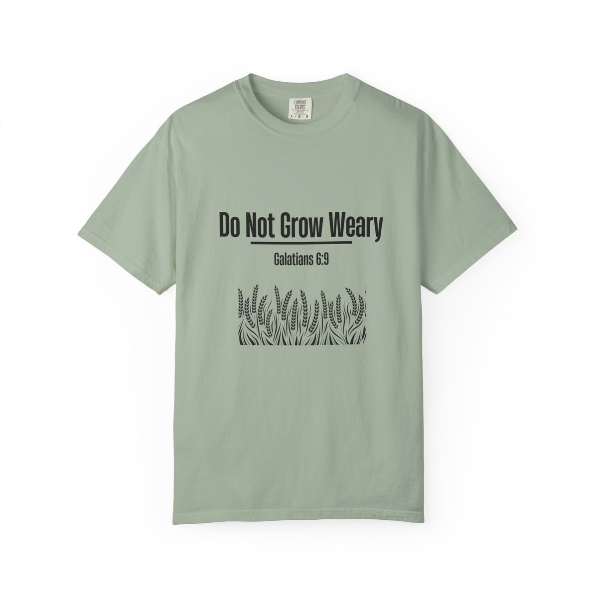 A sage green short-sleeve t-shirt with a dark navy blue graphic print on the front that reads 'WHEN ONE DOOR CLOSES FIND A TRAILHEAD' surrounded by hand-drawn outdoor icons like mountains, trees, a tent, and hiking boots, shown on a plain white background.